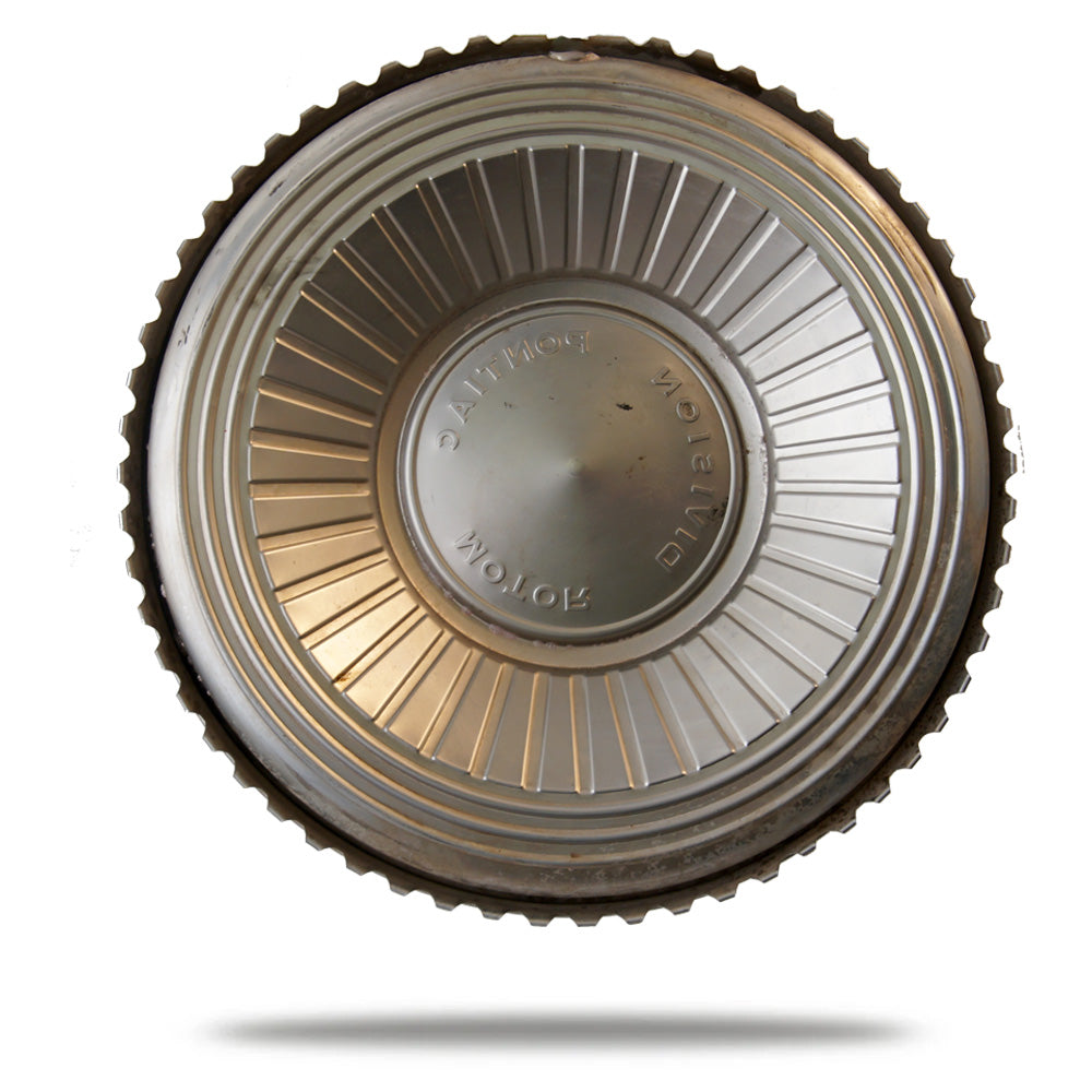 Decorative metal dish with gold and silver accents on a white background
